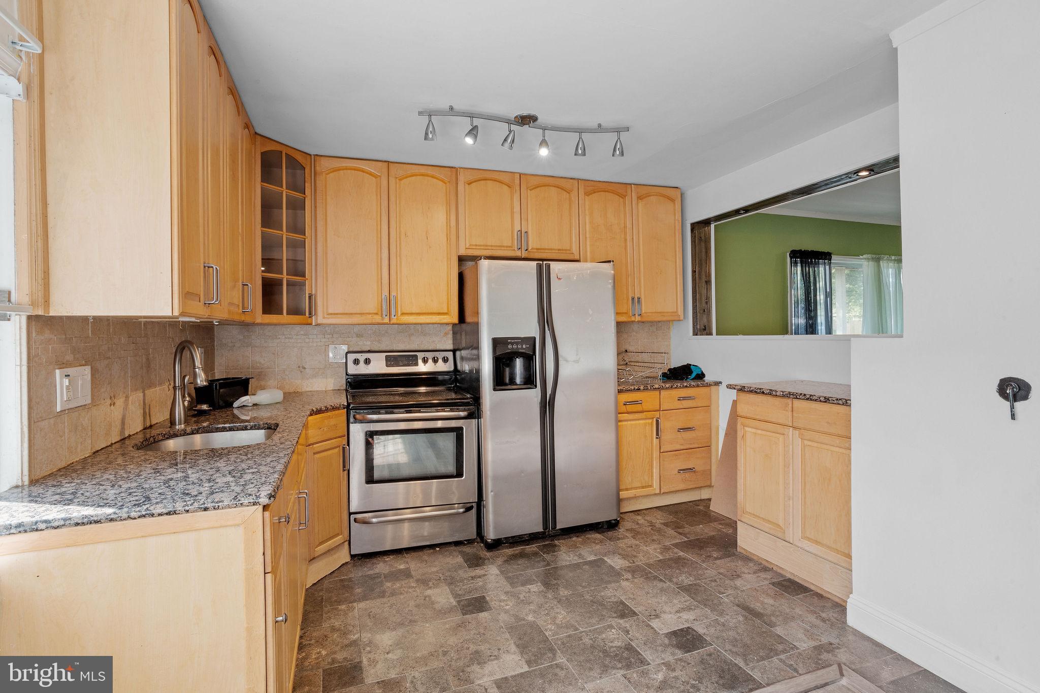 47 Farmbrook Drive Levittown, PA 19055 - Photo 2 of 28 a kitchen with a refrigerator sink and stove
