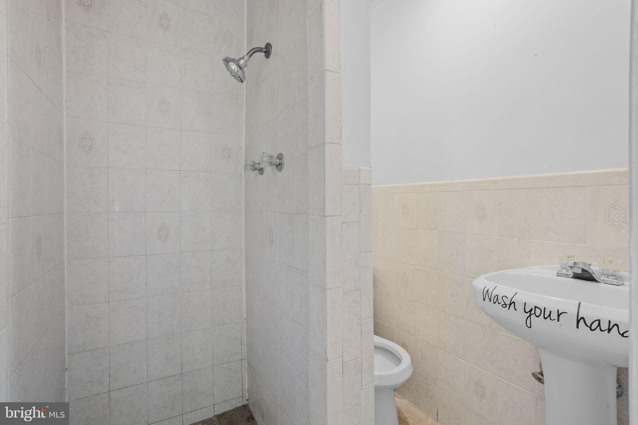 47 Farmbrook Drive Levittown, PA 19055 - Photo 21 of 28 a bathroom with a shower and toilet