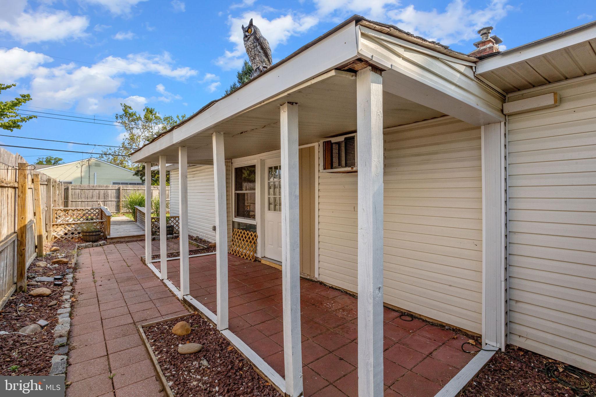 47 Farmbrook Drive Levittown, PA 19055 - Photo 25 of 28 a view of a porch with a table and chairs