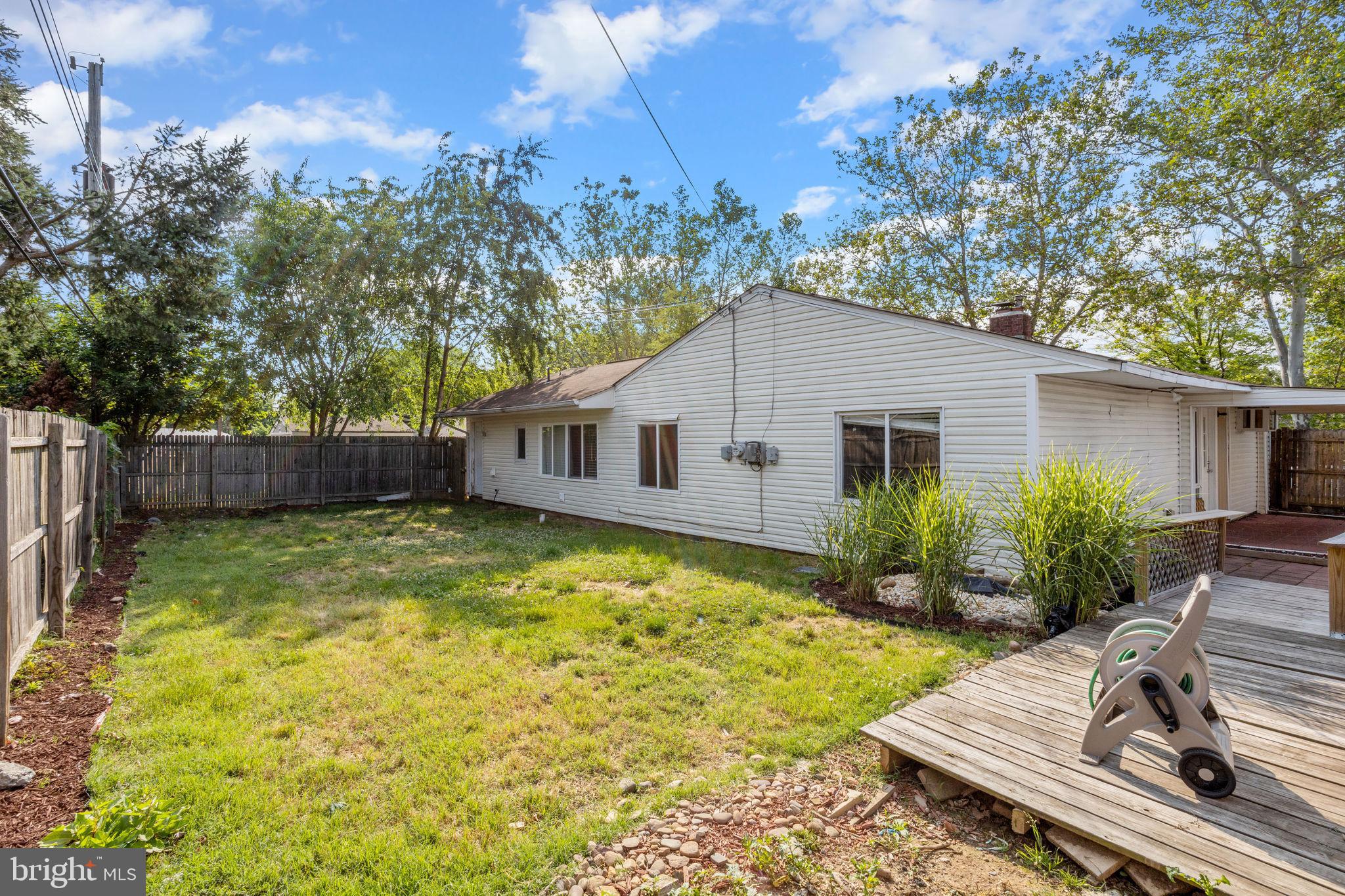47 Farmbrook Drive Levittown, PA 19055 - Photo 27 of 28 a view of a yard with a house and wooden fence