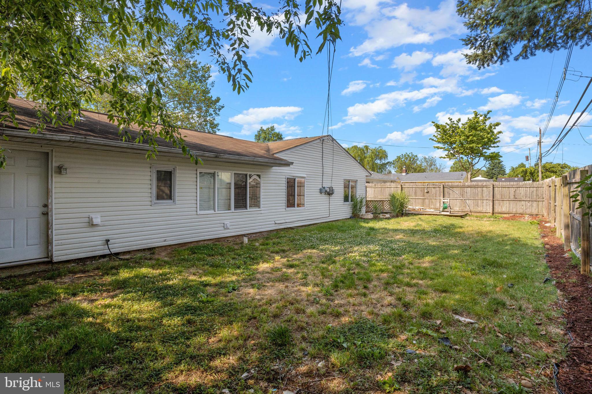 47 Farmbrook Drive Levittown, PA 19055 - Photo 28 of 28 a view of a house with a backyard