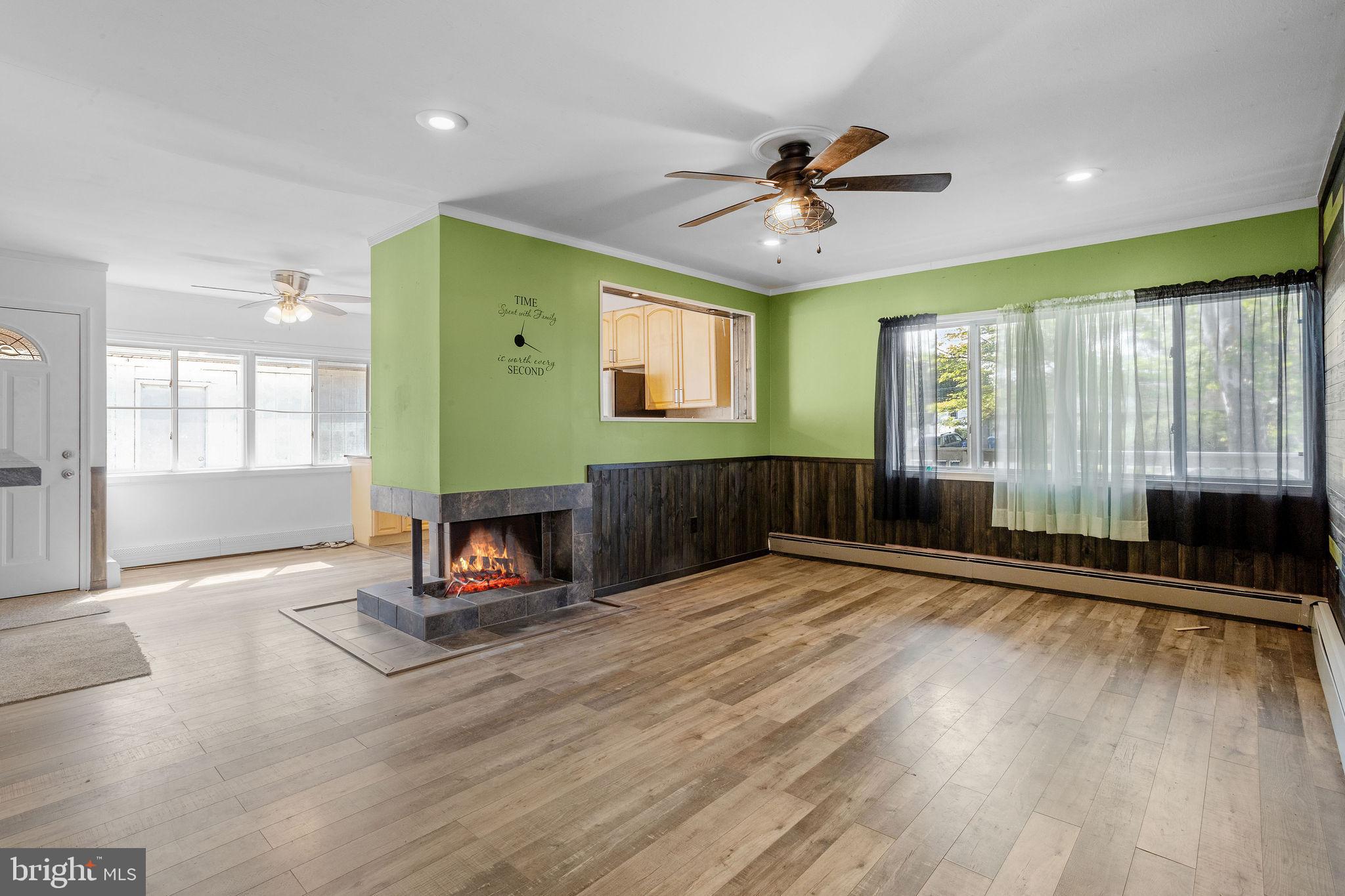 47 Farmbrook Drive Levittown, PA 19055 - Photo 6 of 28 a view of an empty room with a window and wooden floor