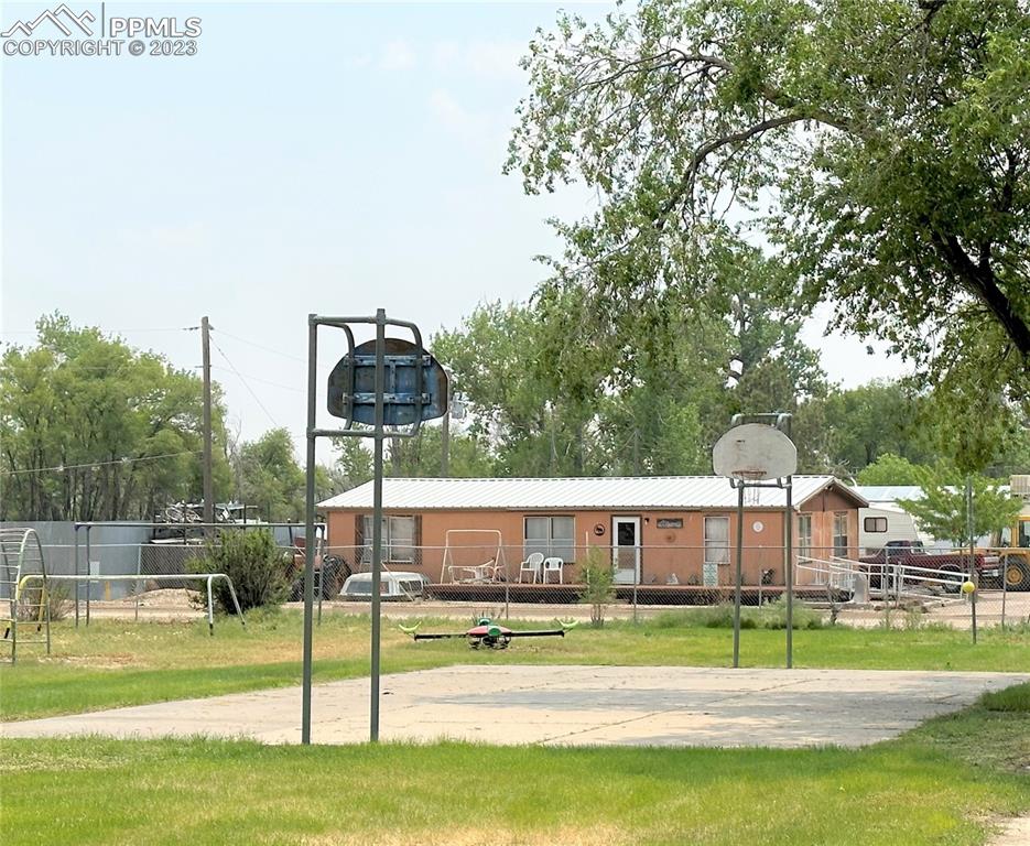 Wilson Avenue Boone, CO 81025 - Photo 8 of 8 a view of swimming pool with a garden and deck