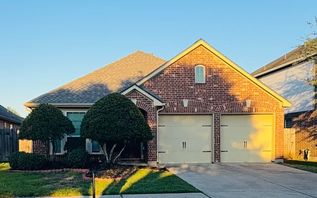 an aerial view of a house with a lake view