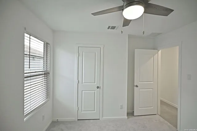 a view of a kitchen with stove and cabinets