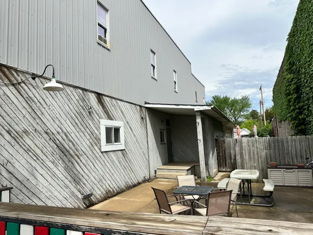 a patio with table and chairs