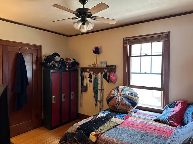 a bedroom with furniture and a window