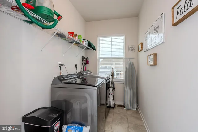 a big room with windows and a flat screen tv