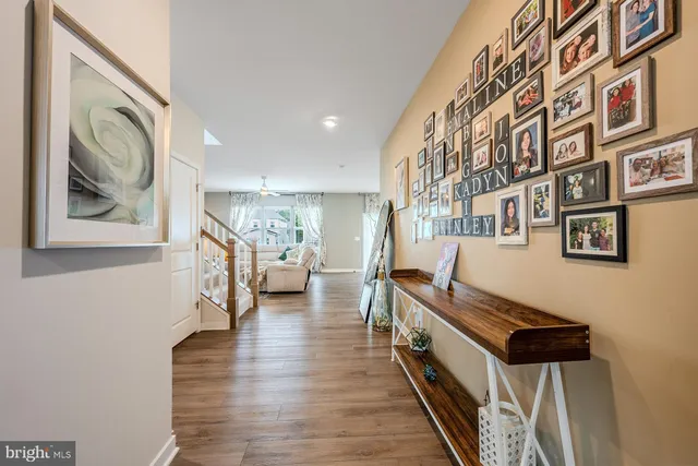 a kitchen with stainless steel appliances kitchen island granite countertop a refrigerator and cabinets