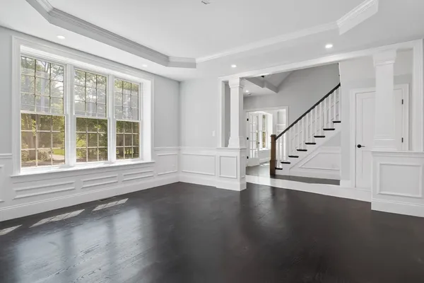 a view of an entryway with wooden floor