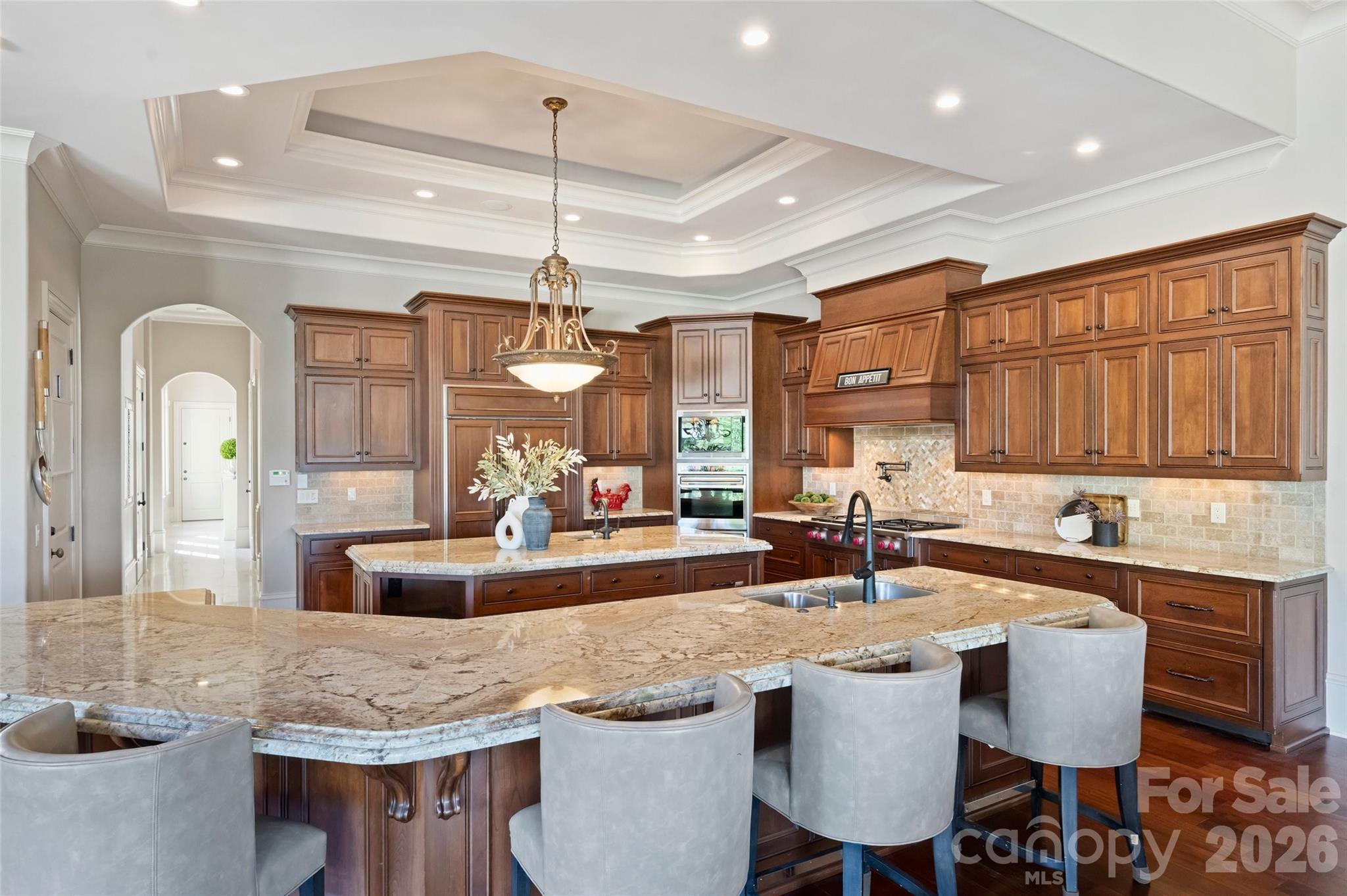 18394 Nantz Road Cornelius, NC 28031 - Photo 14 of 47 a kitchen with center island table and chairs