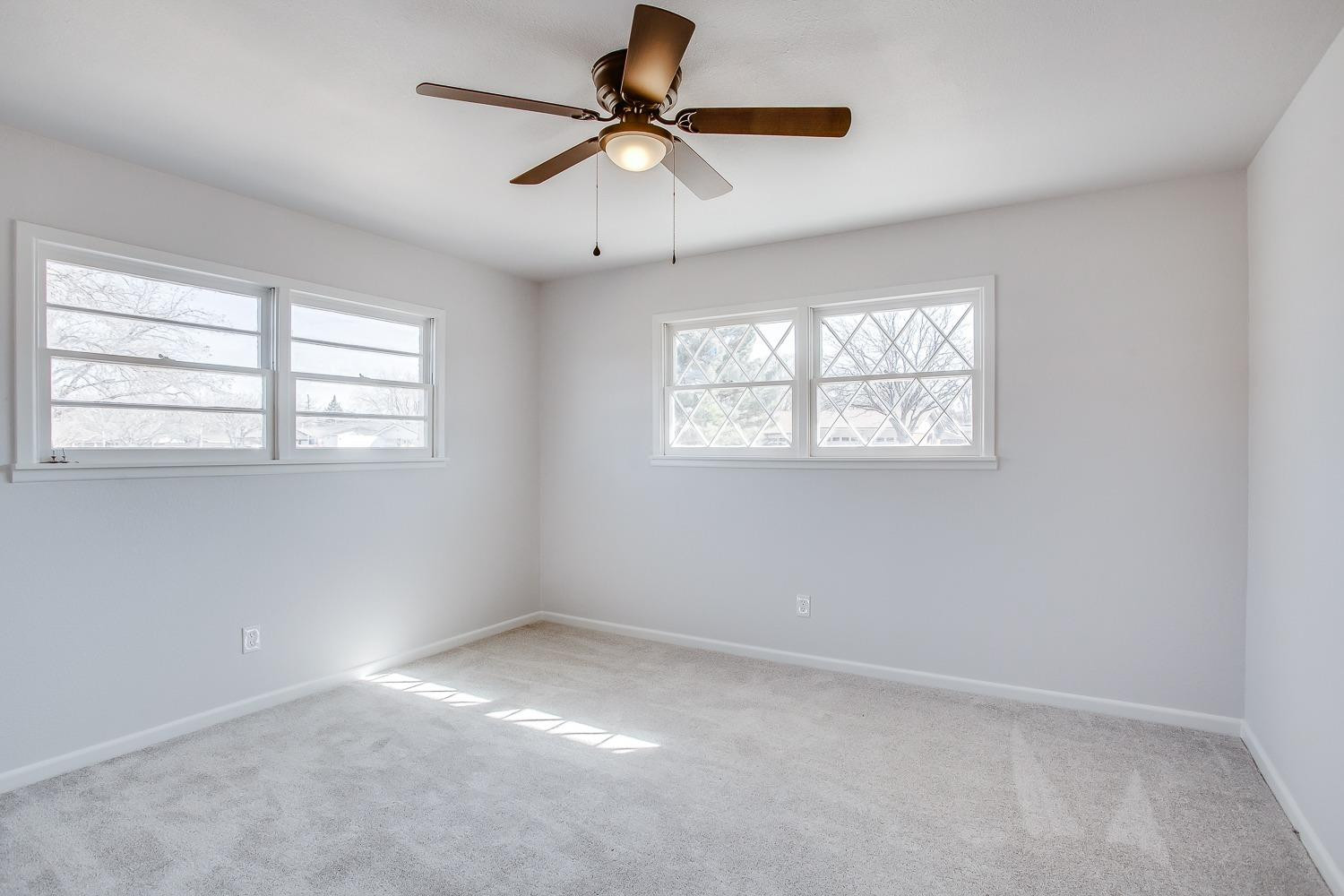 3410 53rd Street Lubbock, TX 79413 - Photo 12 of 14 a view of an empty room with a window