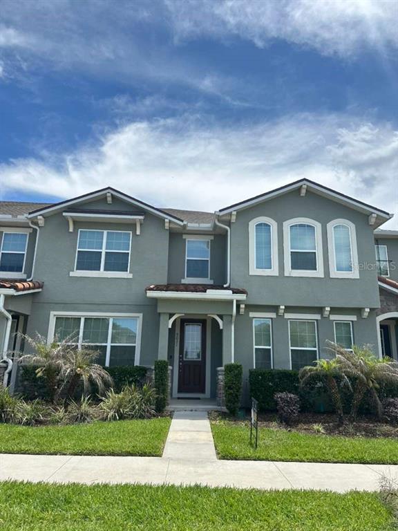 9031 Legado Drive Windermere, FL 34786 - Photo 1 of 27 a front view of a house with a yard