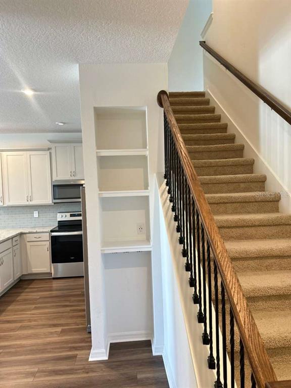 9031 Legado Drive Windermere, FL 34786 - Photo 12 of 27 a view of kitchen with sink microwave and stove