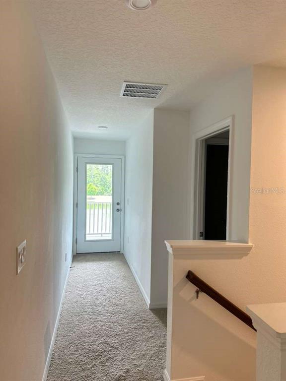 9031 Legado Drive Windermere, FL 34786 - Photo 14 of 27 a view of a hallway with closet
