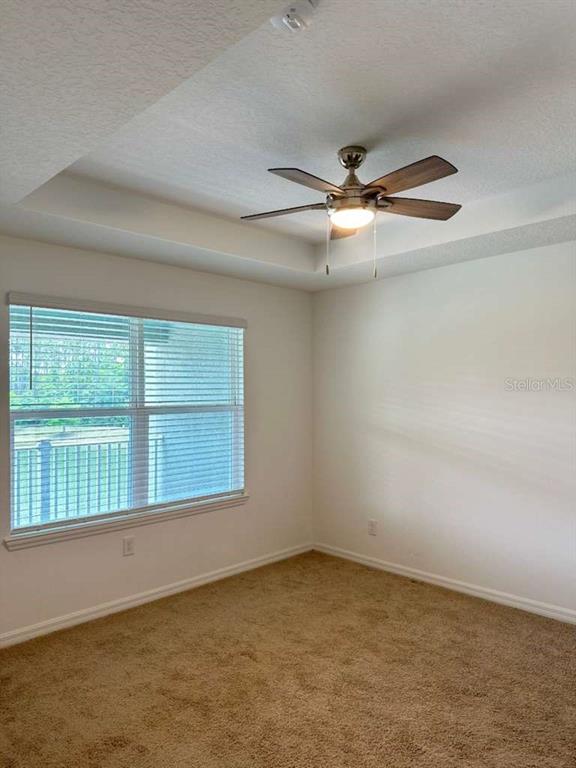 9031 Legado Drive Windermere, FL 34786 - Photo 15 of 27 an empty room with a empty space and windows