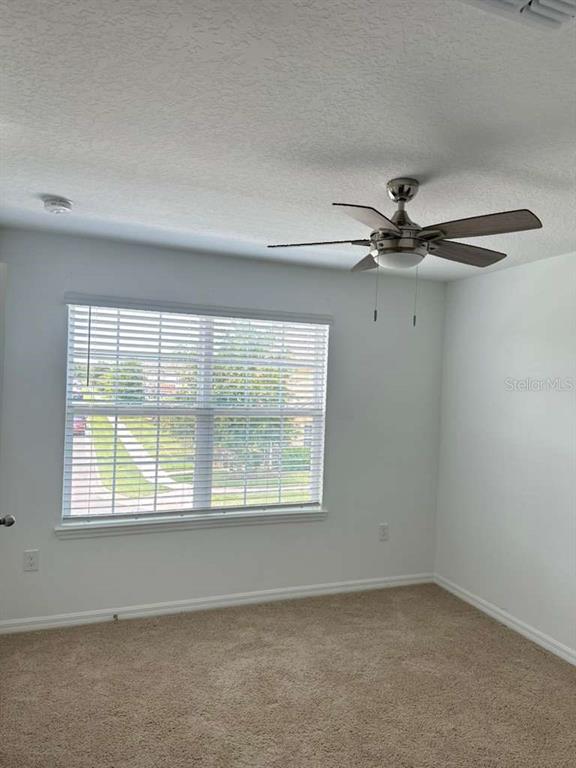 9031 Legado Drive Windermere, FL 34786 - Photo 17 of 27 an empty room with a window