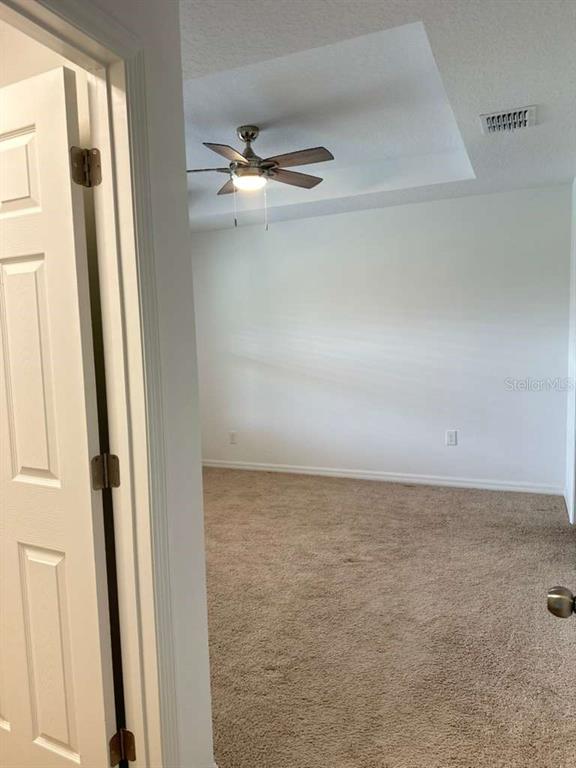 9031 Legado Drive Windermere, FL 34786 - Photo 18 of 27 a view of a room with rack on the wall