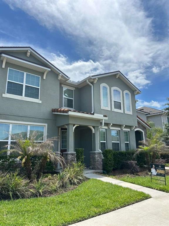 9031 Legado Drive Windermere, FL 34786 - Photo 2 of 27 a front view of a house with a yard