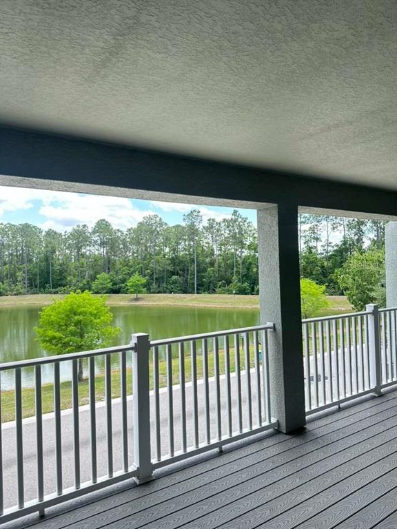 9031 Legado Drive Windermere, FL 34786 - Photo 26 of 27 a view of a balcony with wooden floor