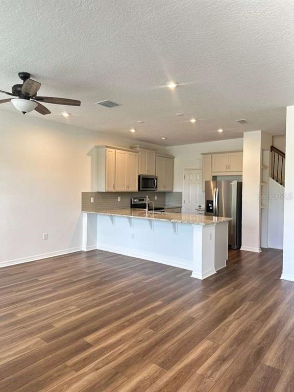 9031 Legado Drive Windermere, FL 34786 - Photo 6 of 27 a view of kitchen with refrigerator microwave and stove