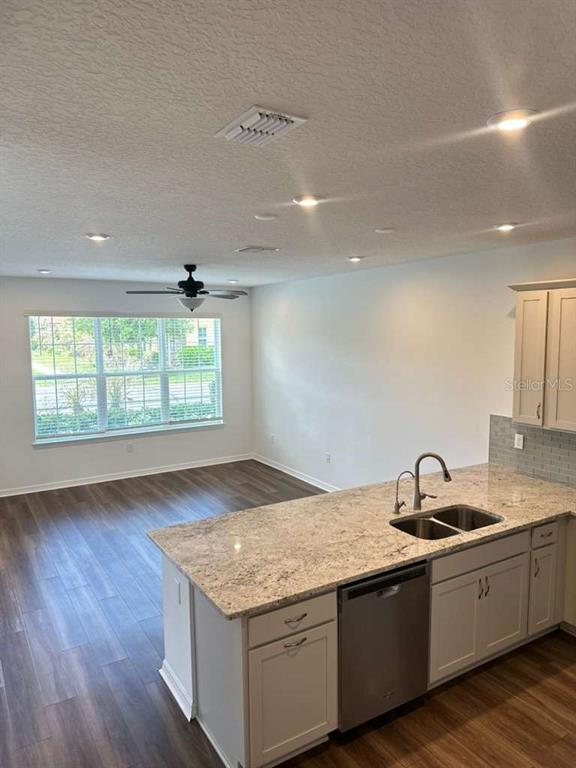 9031 Legado Drive Windermere, FL 34786 - Photo 8 of 27 a kitchen with granite countertop a sink and a window