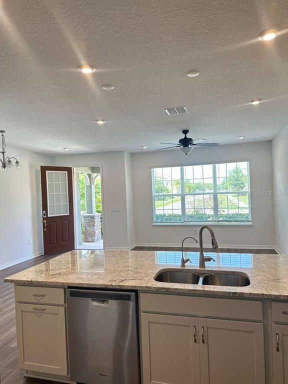 9031 Legado Drive Windermere, FL 34786 - Photo 9 of 27 a kitchen with a sink and large window