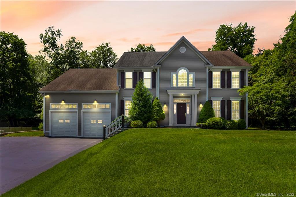 4 Davis Lane Westport, CT 06880 - Photo 1 of 1 a front view of a house with a yard and garage