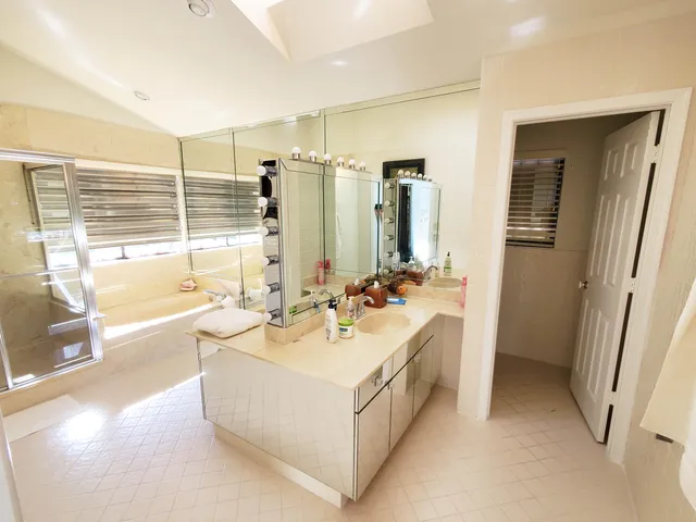 a bathroom with a tub and a shower