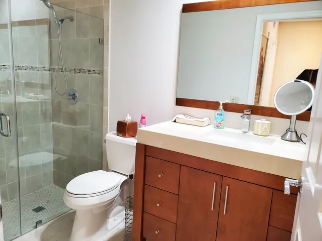 a bedroom with a bed and cabinets