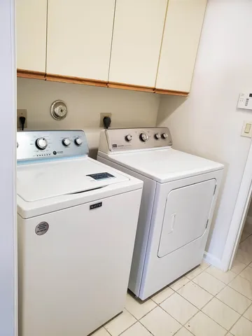 a view of a pathway both side of a house