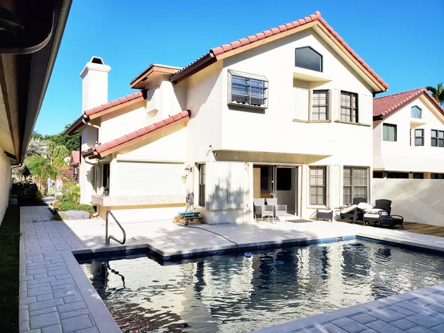 a view of a swimming pool with a patio