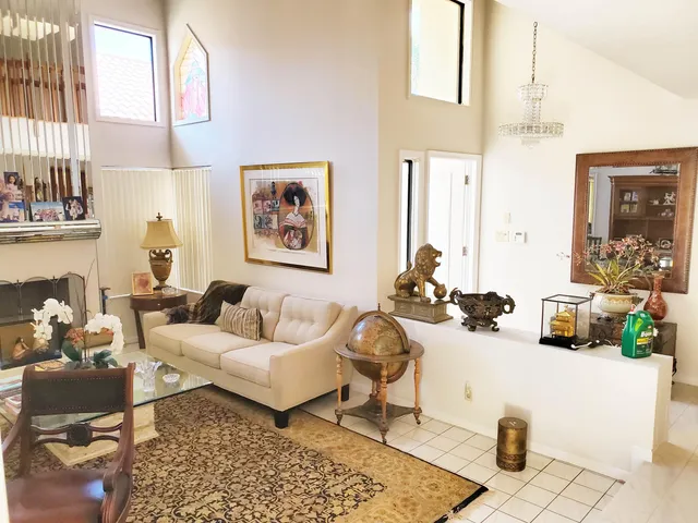 a living room with furniture and next to a window