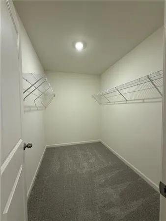 a view of a room with racks on the wall
