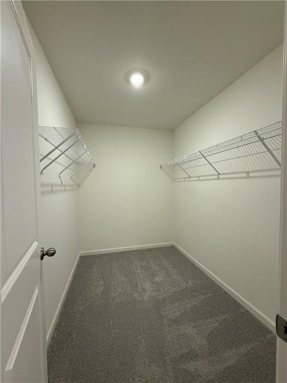 306 Rydal Way Winder, GA 30680 - Photo 14 of 19 a view of a room with racks on the wall