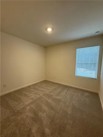 an empty room with a empty space and window