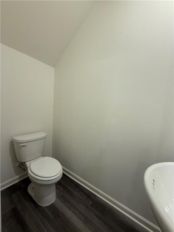 306 Rydal Way Winder, GA 30680 - Photo 7 of 19 a white toilet sitting next to a white wall