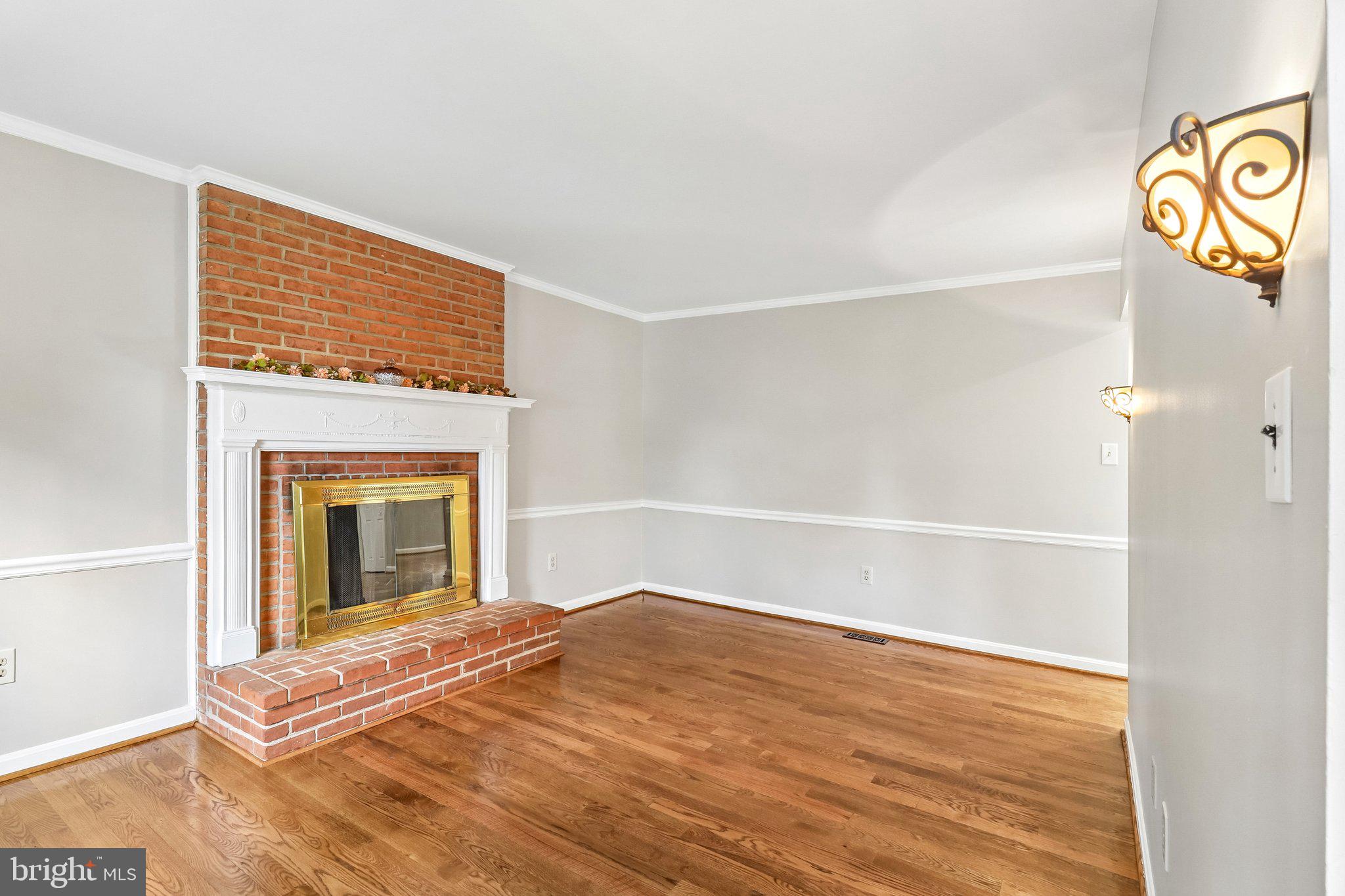12408 Triple Crown Road Gaithersburg, MD 20878 - Photo 11 of 87 Family room with wood burning fireplace.