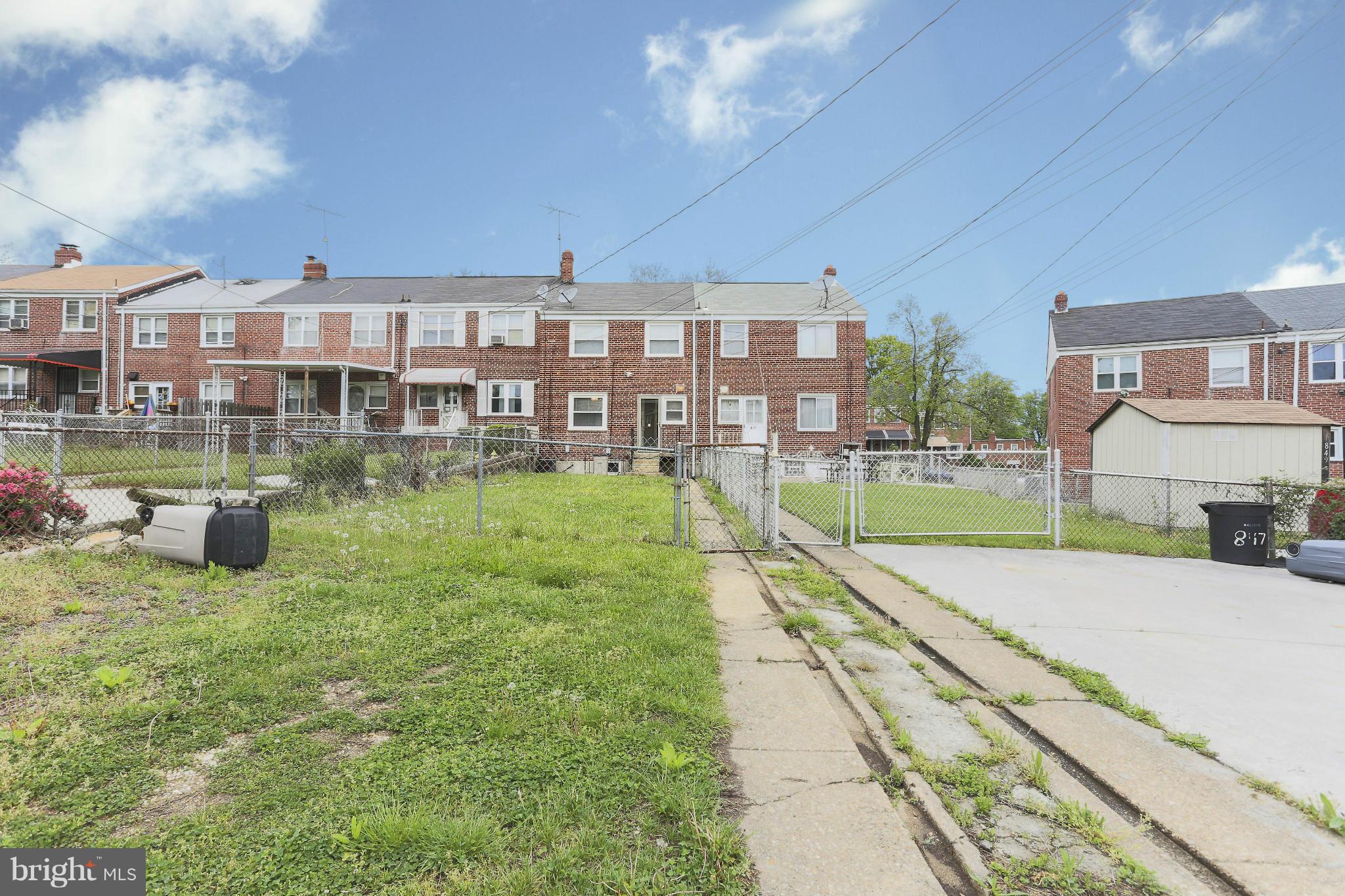 845 Benninghaus Road Baltimore, MD 21212 - Photo 2 of 19 a view of a swimming pool with a patio and a yard