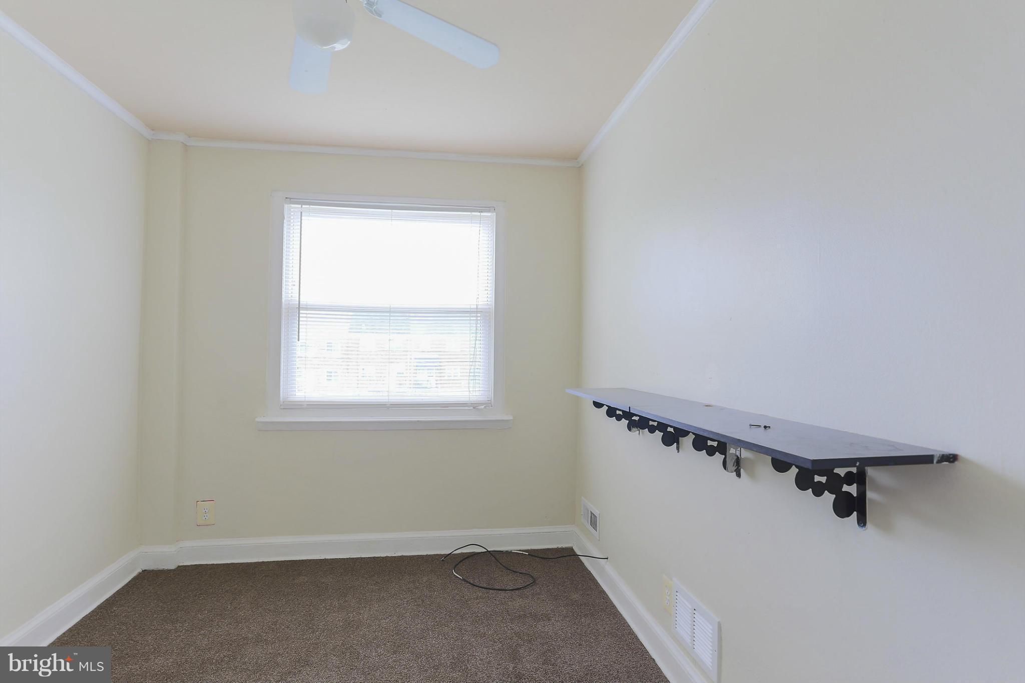 845 Benninghaus Road Baltimore, MD 21212 - Photo 13 of 19 an empty room with a window
