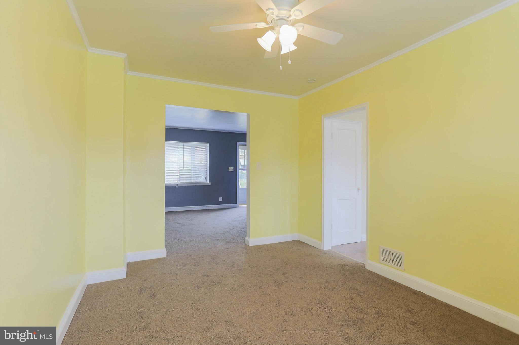 845 Benninghaus Road Baltimore, MD 21212 - Photo 8 of 19 a view of a big room with wooden floor and closet in a room