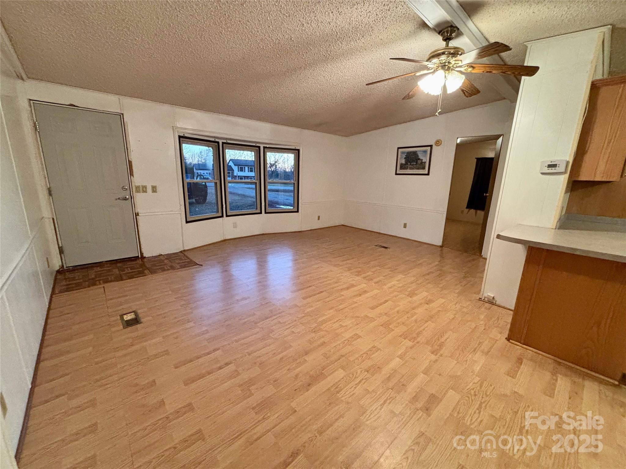 298 West B Phindeck Road Bostic, NC 28018 - Photo 13 of 34 wooden floor in an empty room with a window