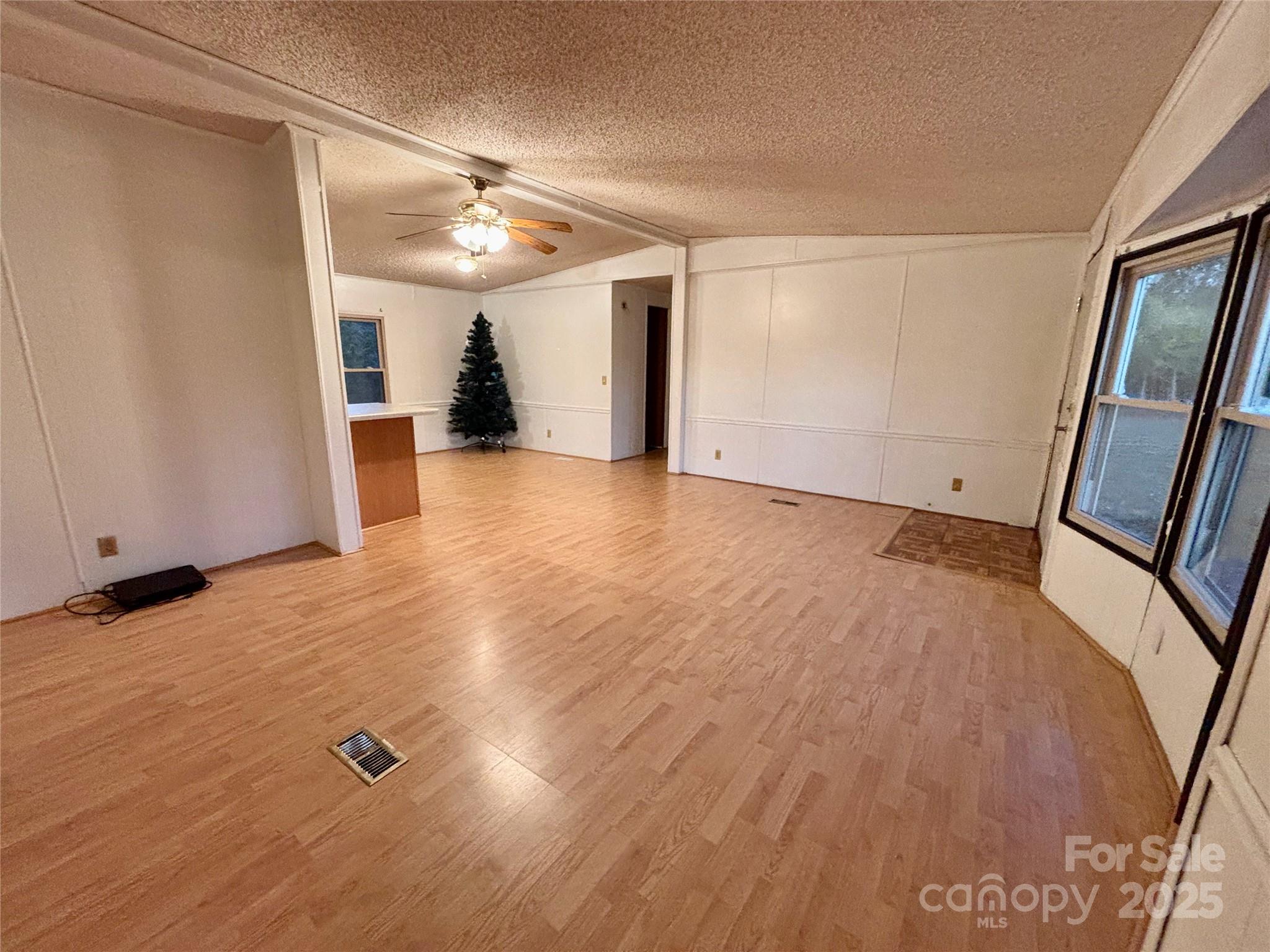 298 West B Phindeck Road Bostic, NC 28018 - Photo 20 of 34 a view of a livingroom with wooden floor and staircase