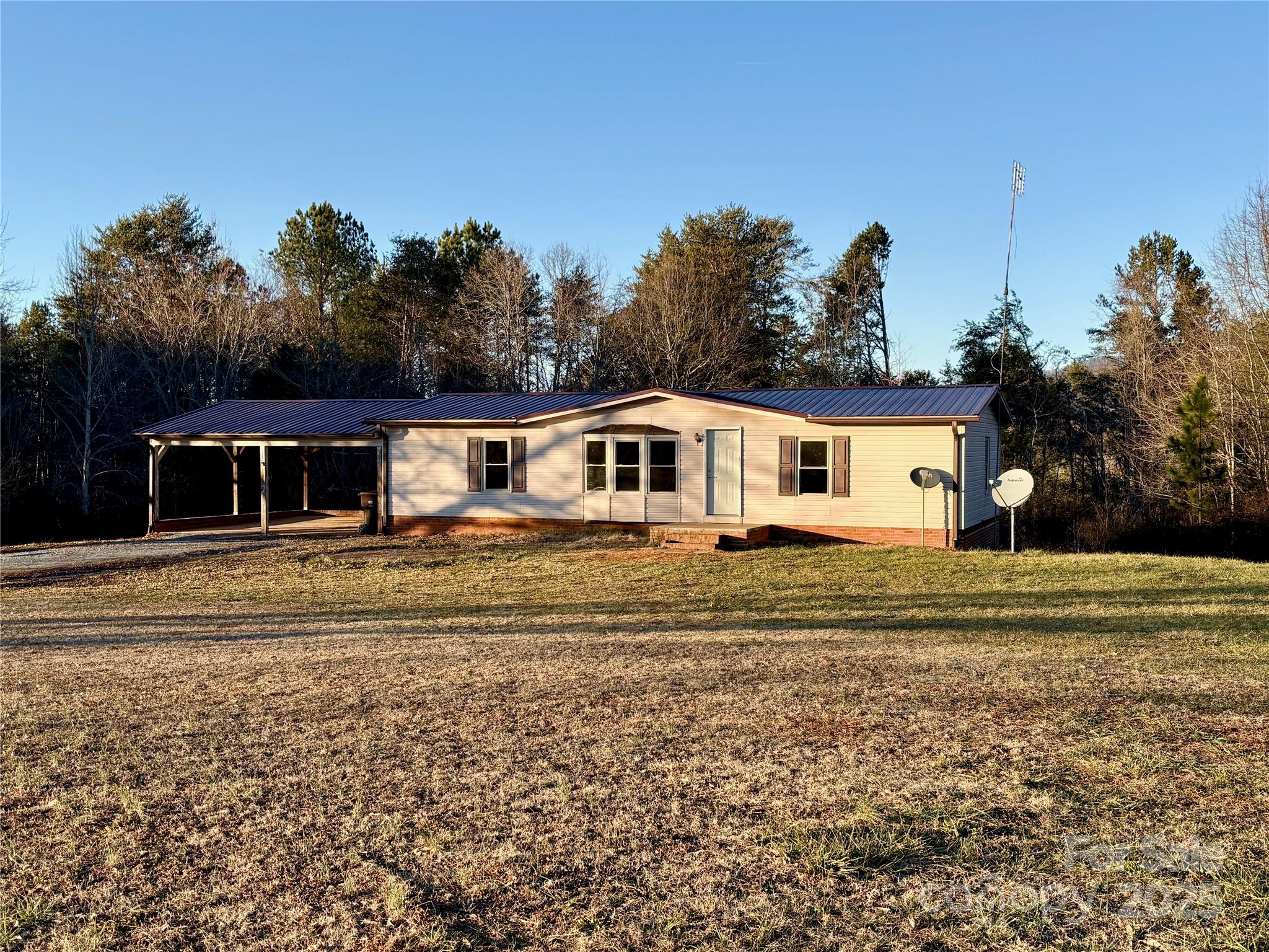 298 West B Phindeck Road Bostic, NC 28018 - Photo 2 of 34 a front view of a house with a yard