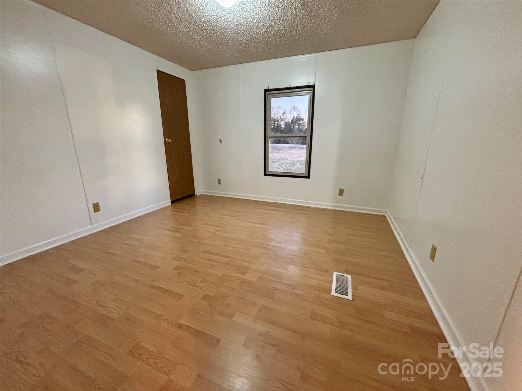 298 West B Phindeck Road Bostic, NC 28018 - Photo 25 of 34 an empty room with windows