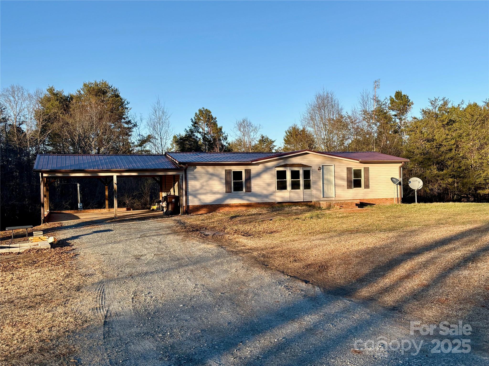 298 West B Phindeck Road Bostic, NC 28018 - Photo 4 of 34 a front view of a house with a yard
