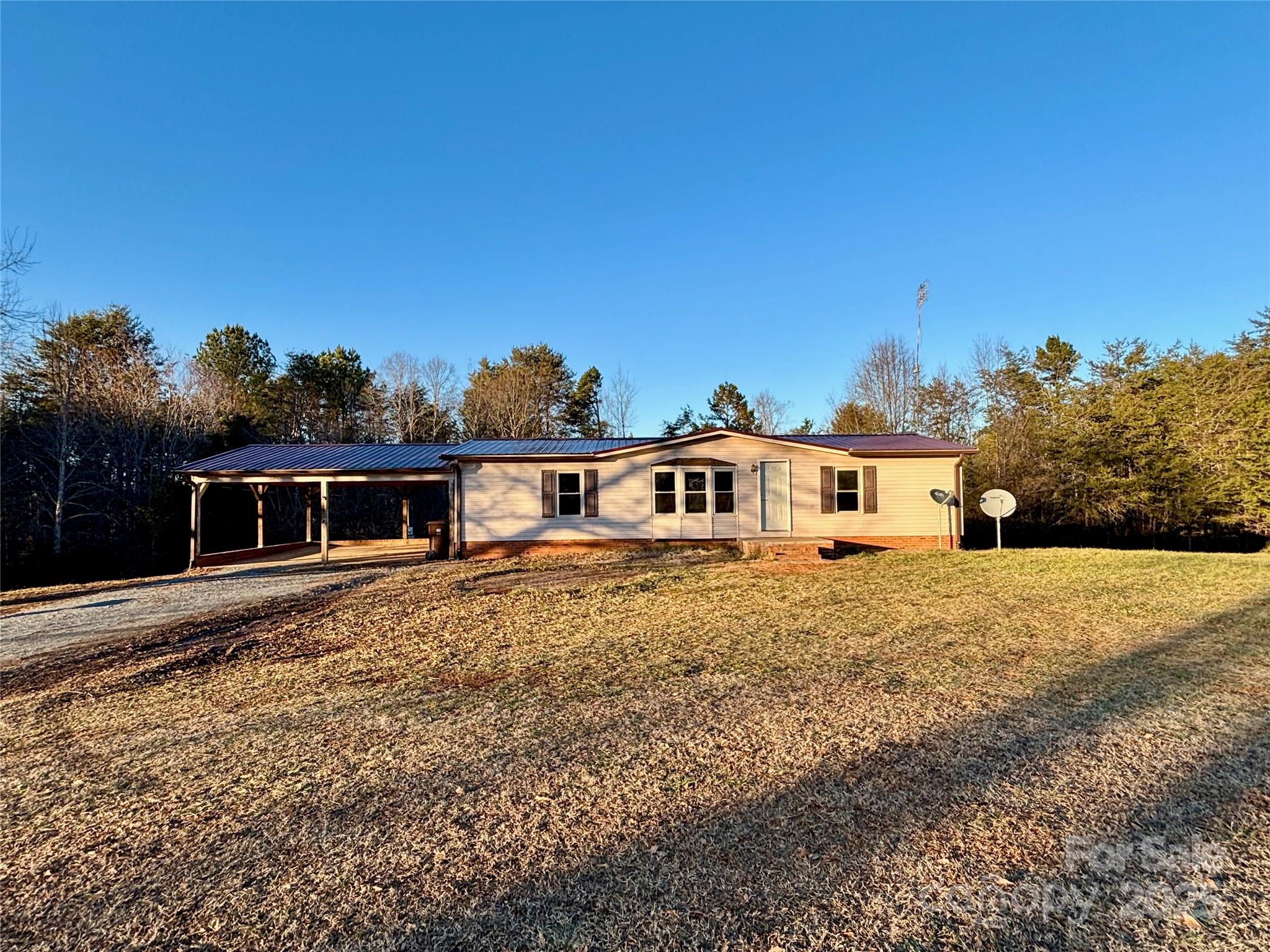 298 West B Phindeck Road Bostic, NC 28018 - Photo 5 of 34 a front view of a house with a yard