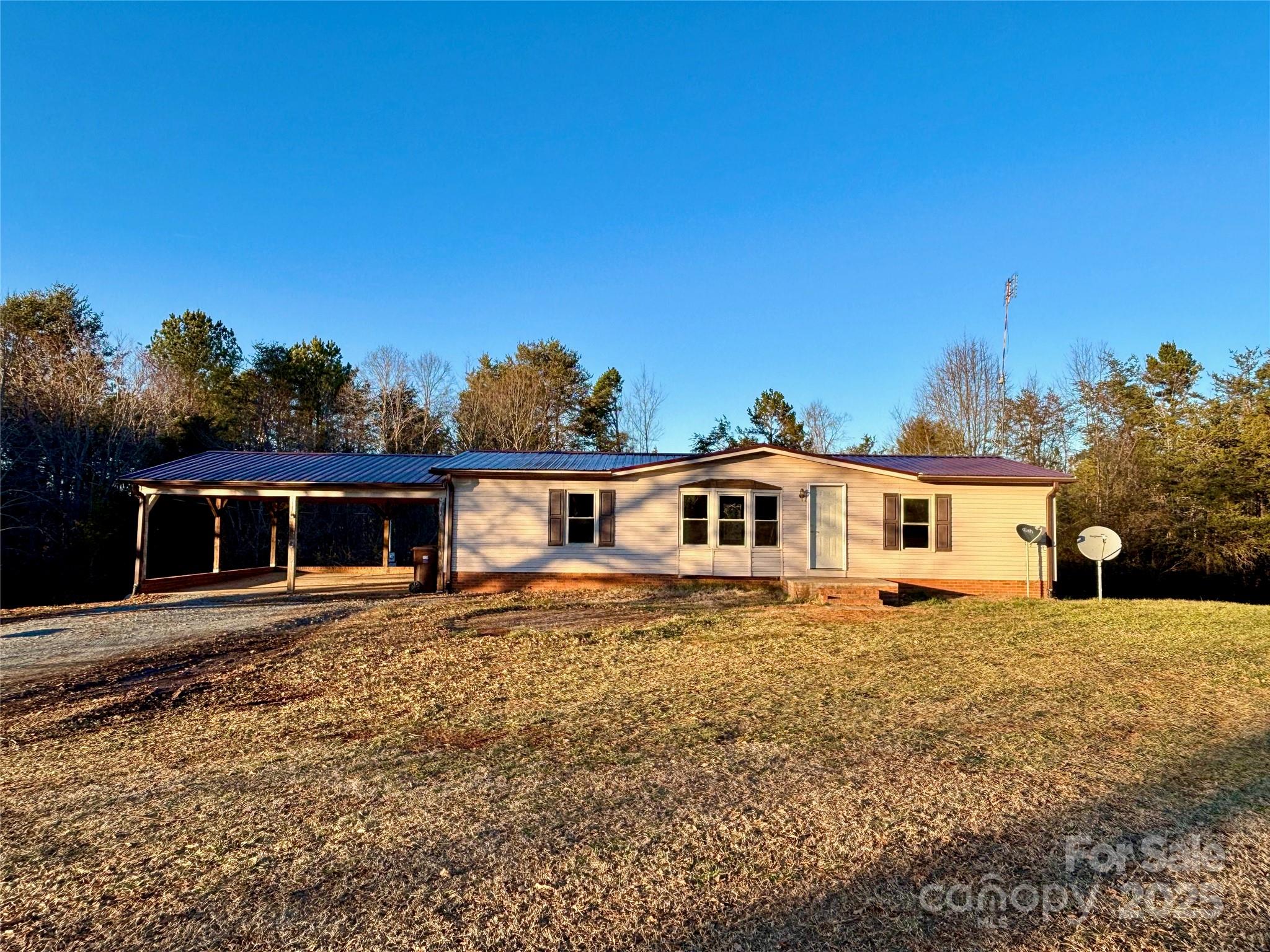 298 West B Phindeck Road Bostic, NC 28018 - Photo 6 of 34 a front view of a house with a yard