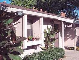 a front view of a house with large windows
