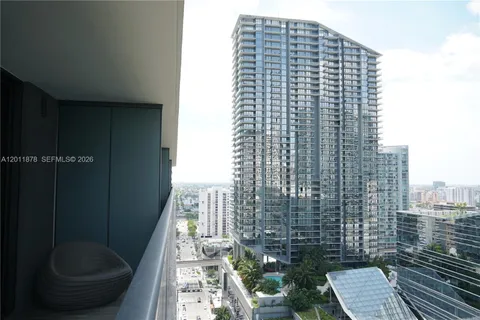 a view of balcony with furniture